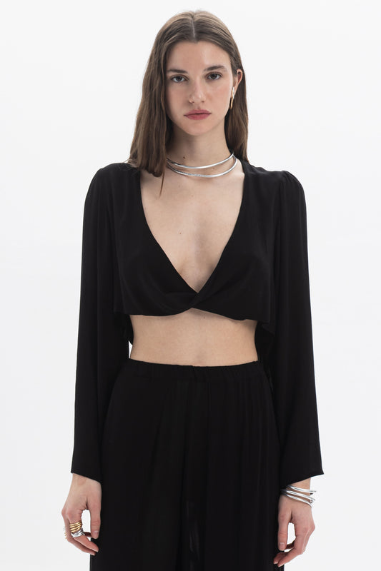 Draped Cropped Long Sleeve Top in black with deep V neckline and fluid silhouette.