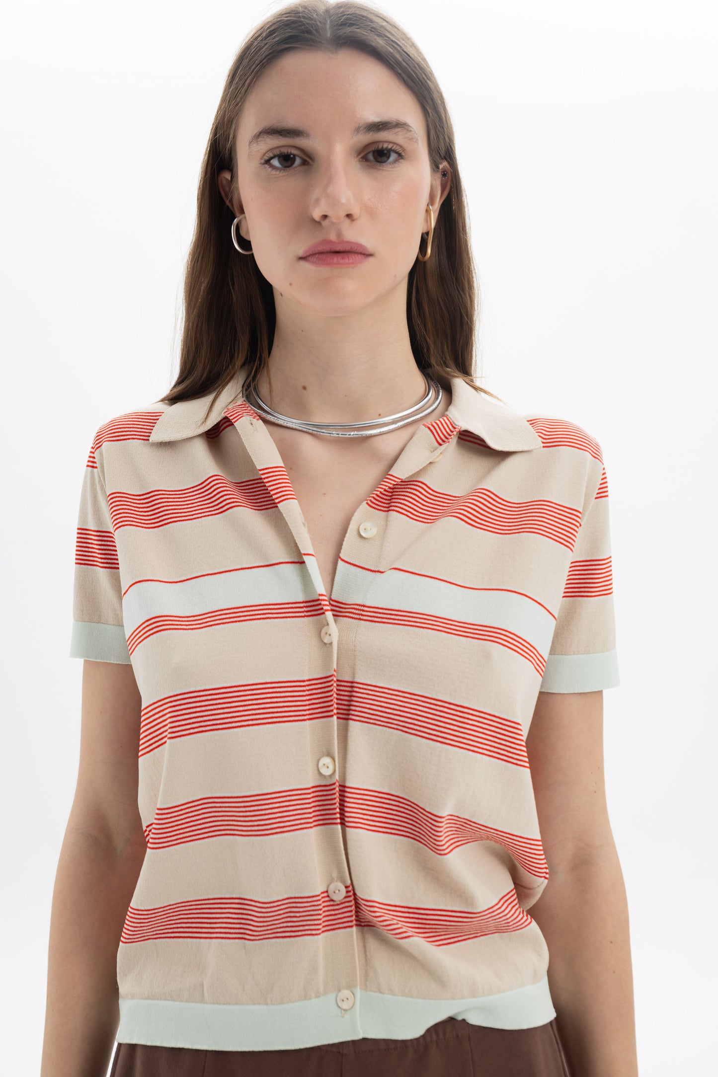 Striped Knit Polo featuring a relaxed silhouette and front button closure with a horizontal stripe pattern.