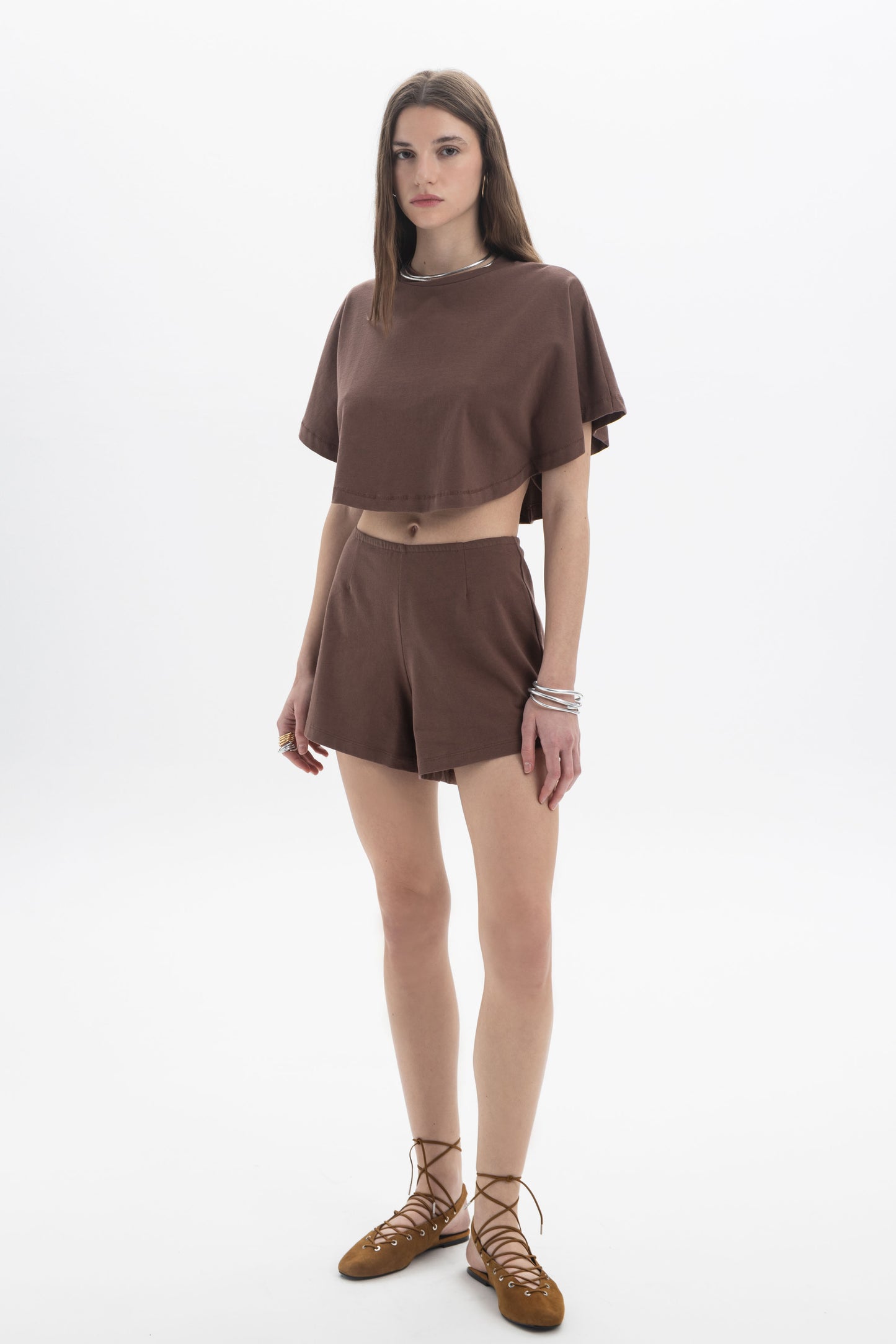 B&B x F Cropped Short Sleeve Top worn by a model, featuring a relaxed silhouette in a brown color.