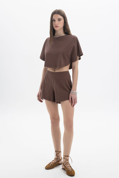 B&B x F Cropped Short Sleeve Top worn by a model, featuring a relaxed silhouette in a brown color.