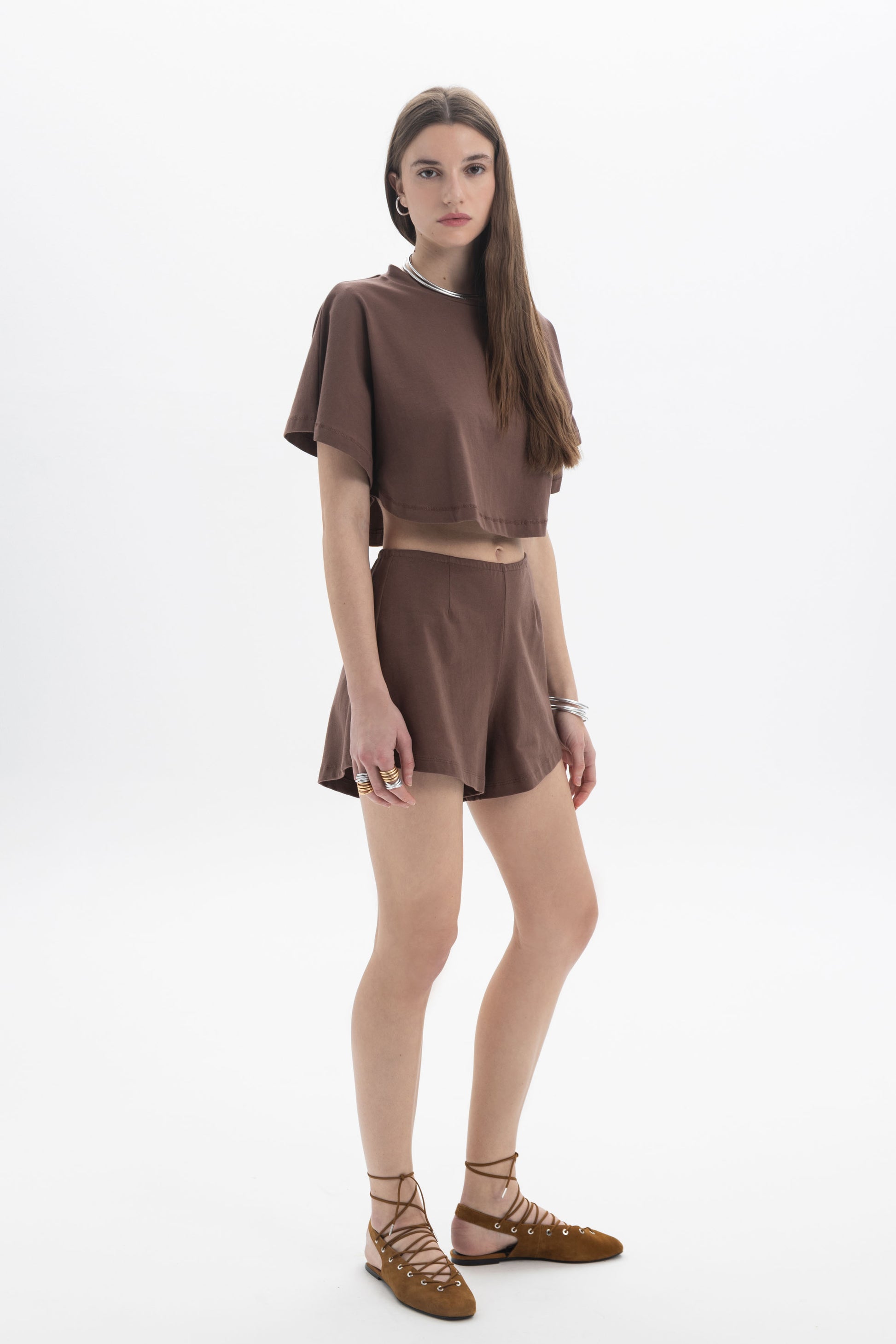 B&B x F Cropped Short Sleeve Top modeled by a woman in a brown outfit with a relaxed silhouette and short sleeves.