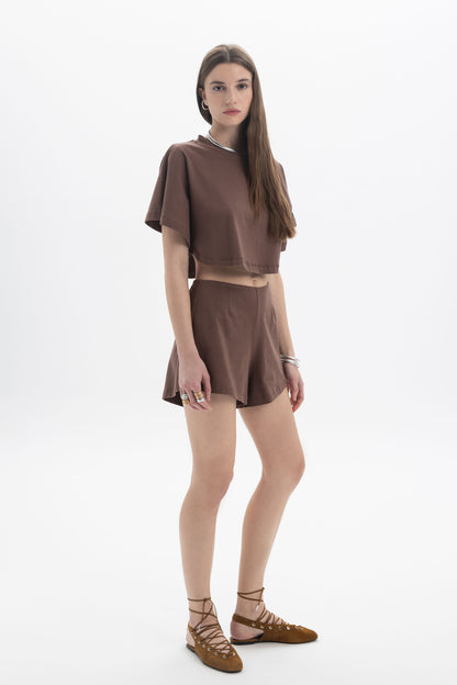 B&B x F Cropped Short Sleeve Top modeled by a woman in a brown outfit with a relaxed silhouette and short sleeves.