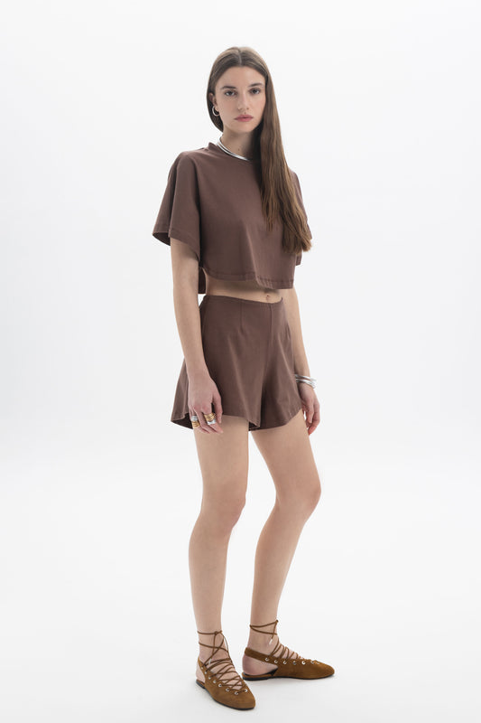 B&B x F Cropped Short Sleeve Top modeled by a woman in a brown outfit with a relaxed silhouette and short sleeves.