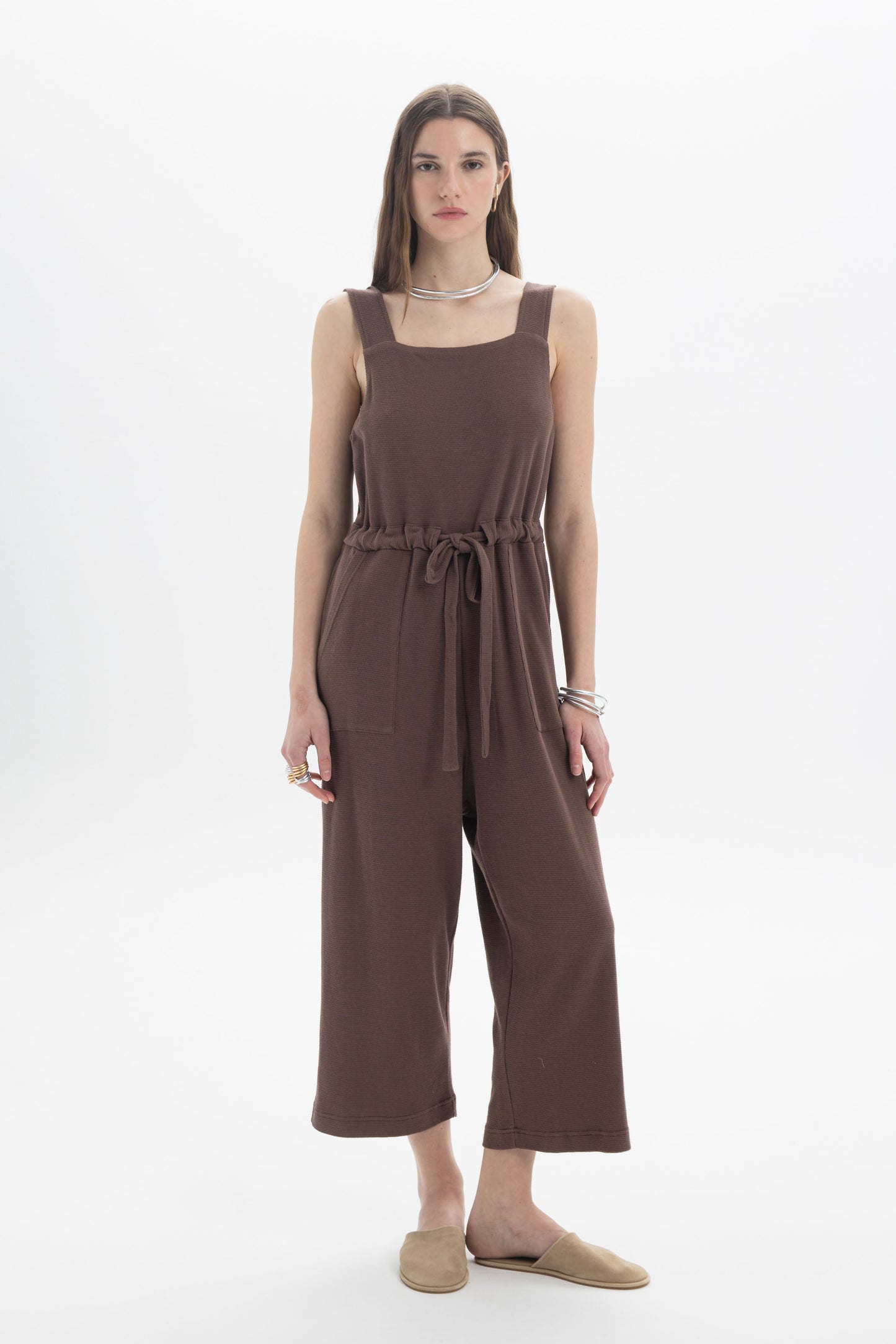 B&B x F Belted Jumpsuit featuring a square neckline, wide shoulder straps, and adjustable drawstring waist in brown.