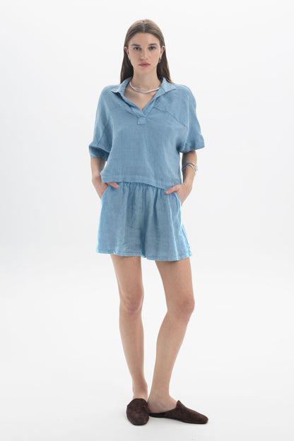 Black and Black linen shorts in a light, breathable fabric with a relaxed fit, suitable for casual summer wear.