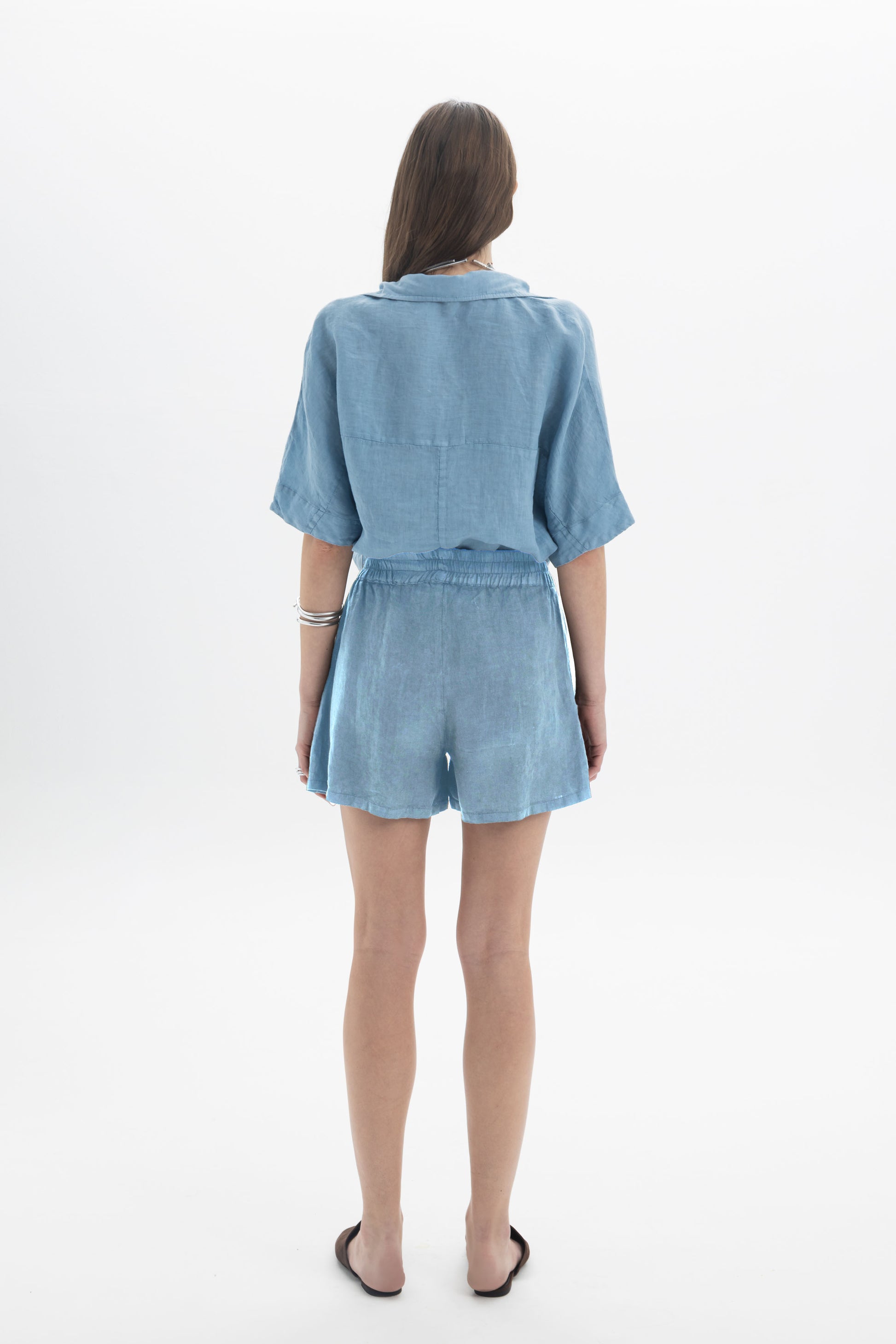 Black and Black linen shorts with a relaxed fit, featuring a comfortable waistband and light, breathable fabric.