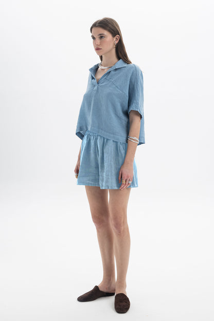 Black and Black linen shorts in natural beige color, lightweight and comfortable, shown on a model against a neutral background.