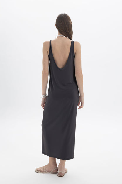 Black and Black open back tank dress displayed on a model, featuring a sleeveless design and stylish open back detail.