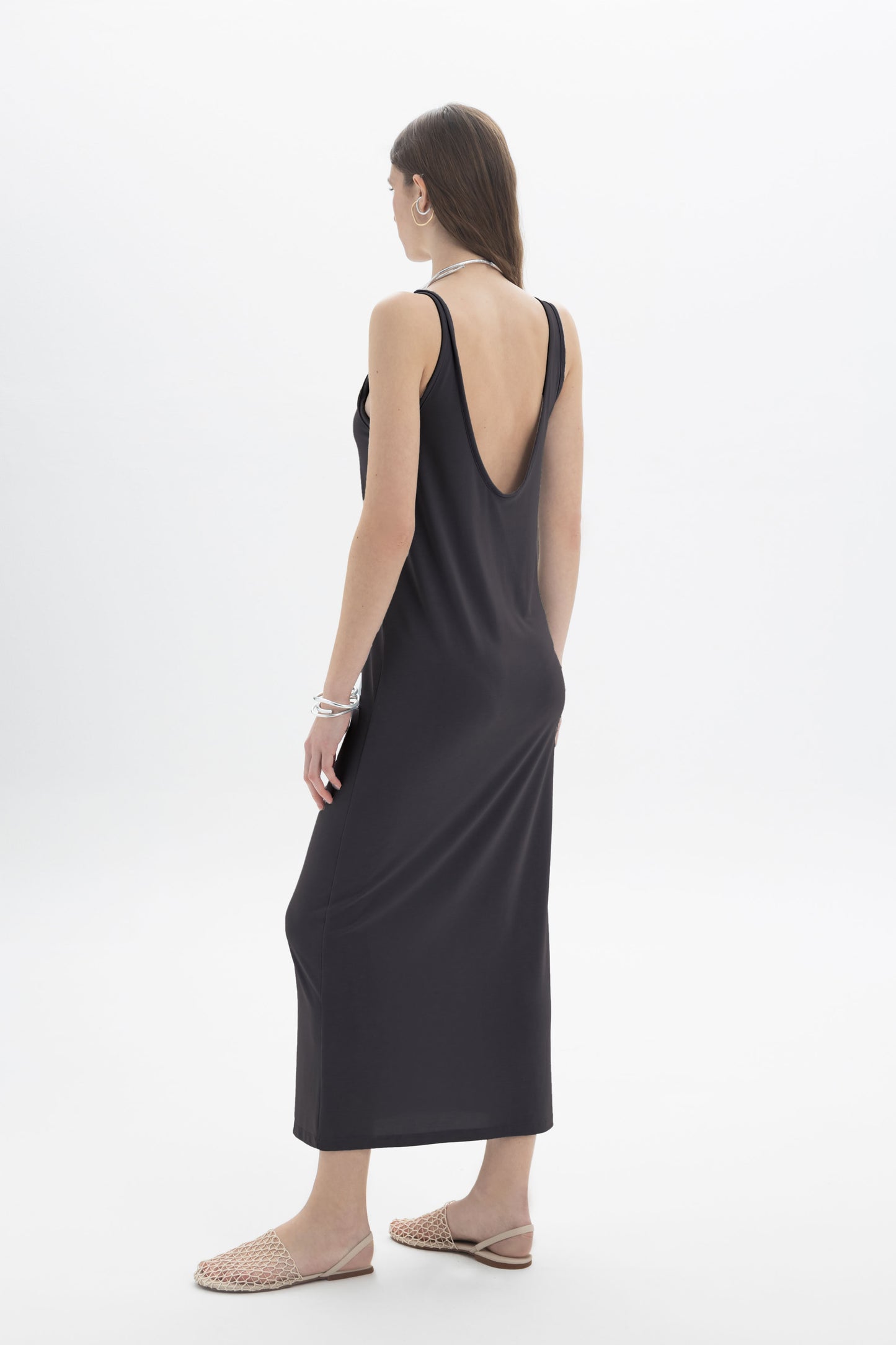 Black and Black open back tank dress with a flowy fit, sleeveless design, and stylish open back detail.