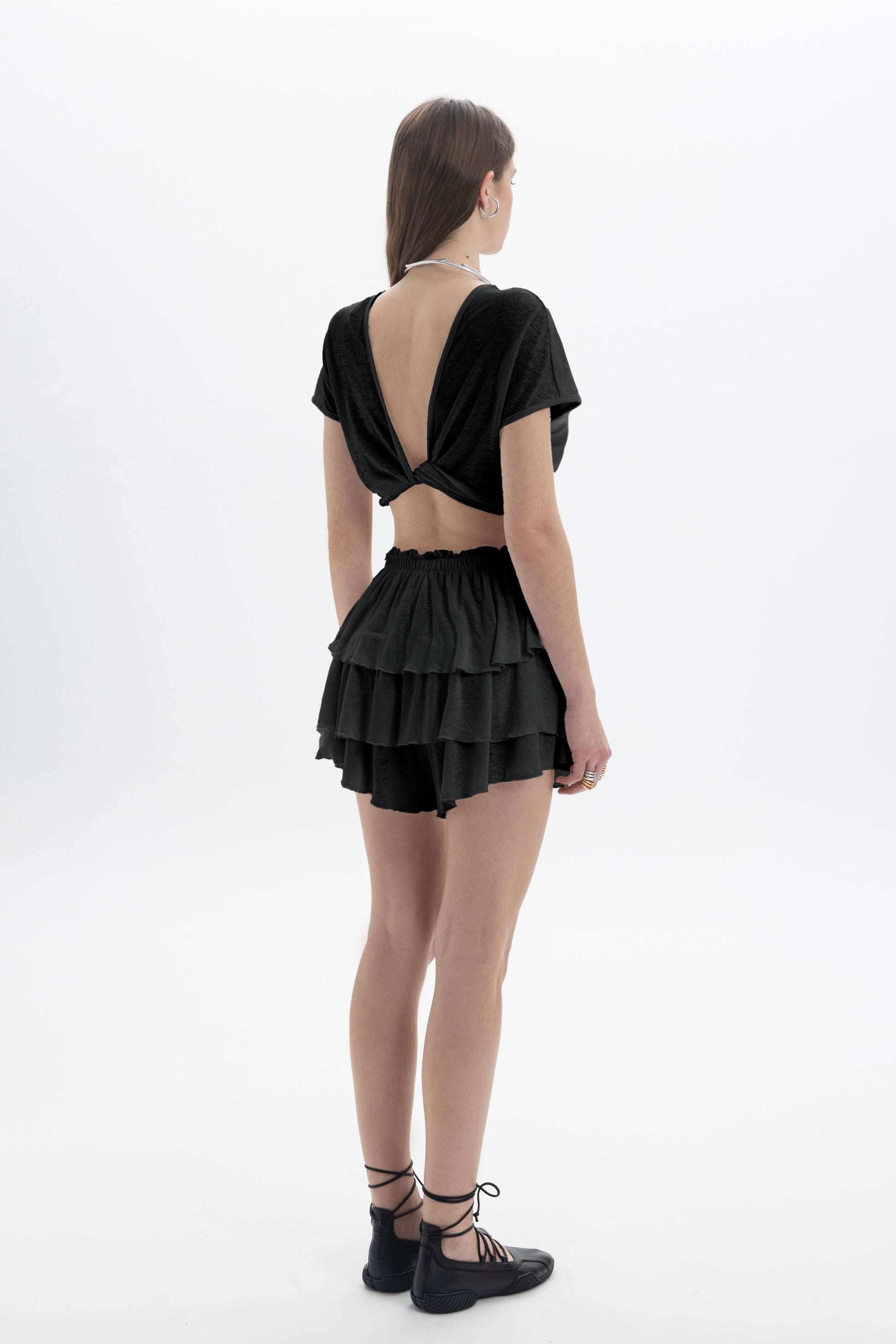 Black and Black B&B x F Twist Back Crop Top, front view showing the fitted black crop top with twist back detail.