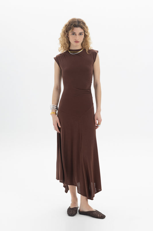 Asymmetric Midi Dress in brown with sleeveless design, side ruching, and flowing asymmetric hem.