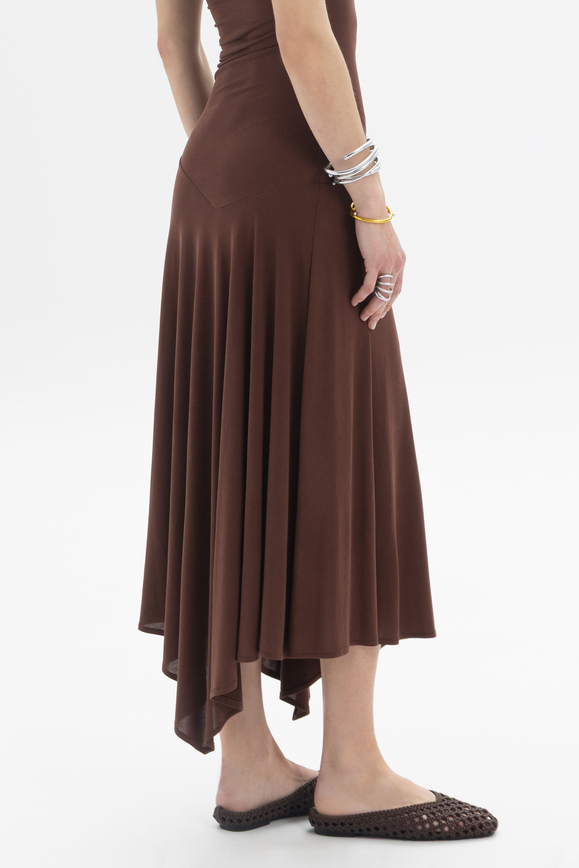 Asymmetric Midi Dress showcasing side ruching and an asymmetric hem with a flared fit, in a rich brown color.