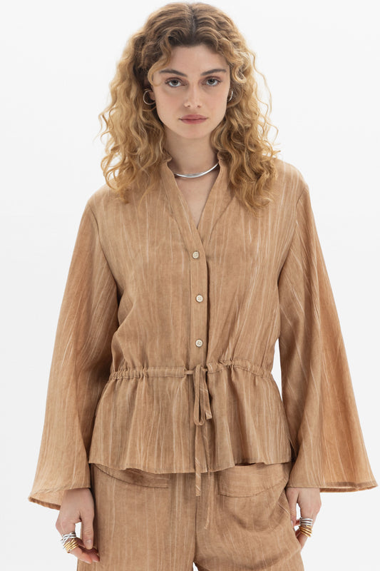 Front view of Drawstring Waist Blouse featuring long sleeves, button closure, and adjustable waist in a relaxed fit.