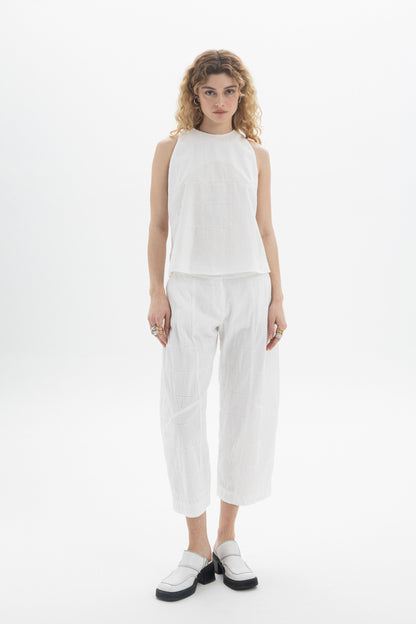 Cropped Straight Pants styled with a lightweight white top, emphasizing relaxed fit and contemporary comfort.