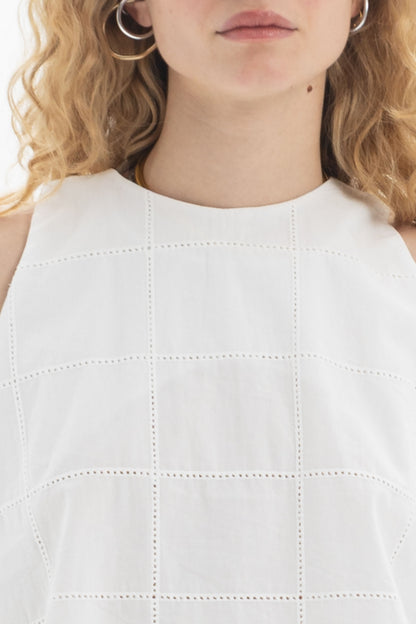 Sleeveless High-Neck Top featuring a clean high neckline and subtle textured detailing in a relaxed fit.