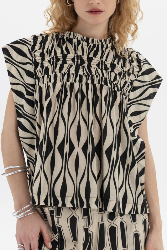 Gathered Sleeveless Top featuring gathered detailing and soft volume in a relaxed fit with fluid silhouette.