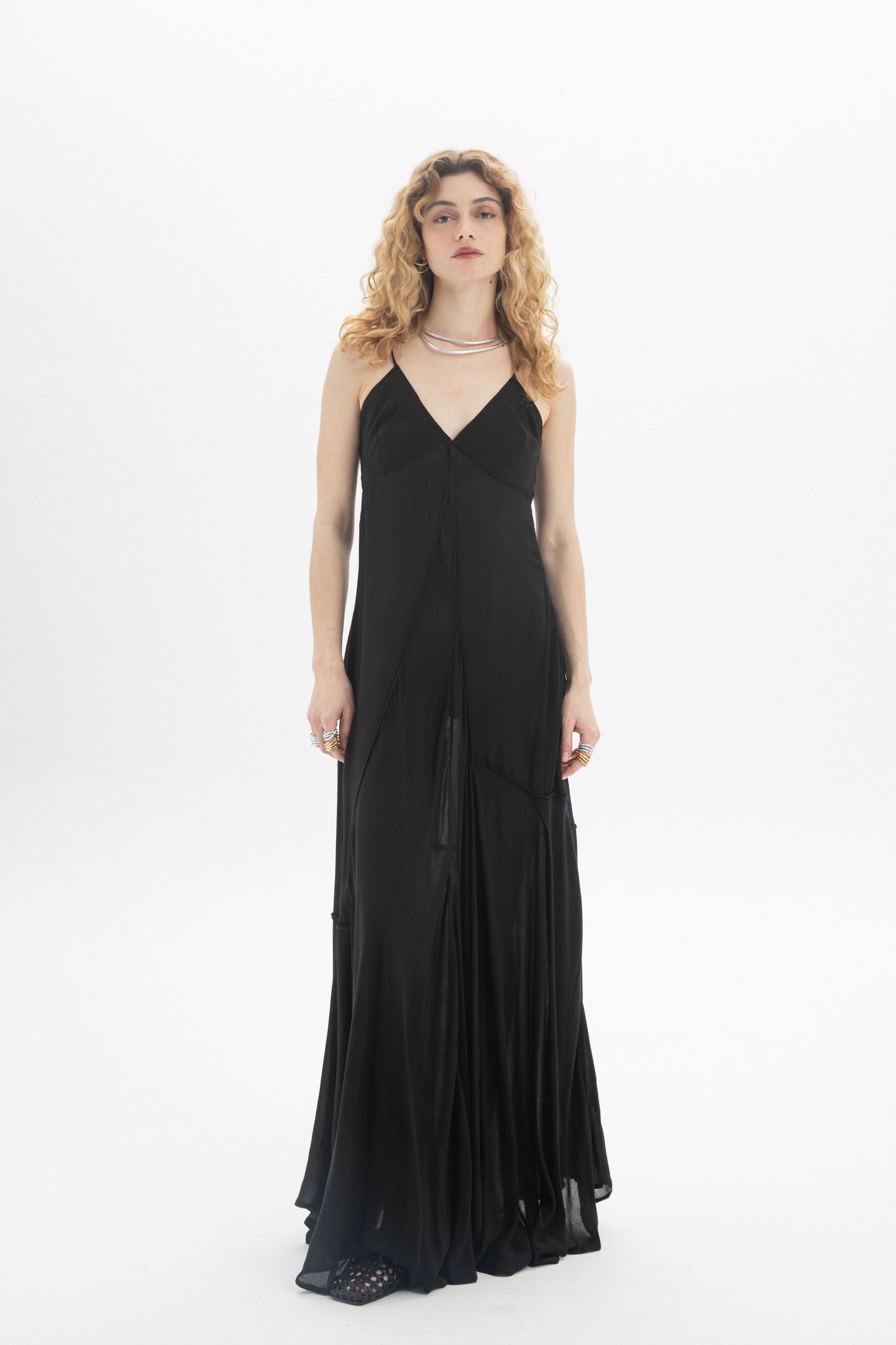 V-Neck Maxi Dress in black with thin straps and a flowing tiered hem, styled in a relaxed fit for comfort.