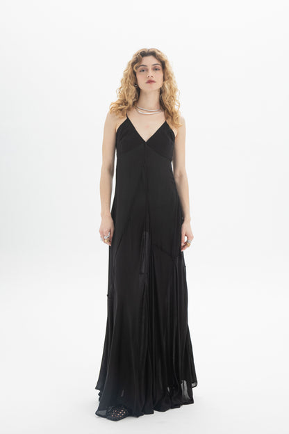 V-Neck Maxi Dress in black with thin straps and a flowing tiered hem, styled in a relaxed fit for comfort.