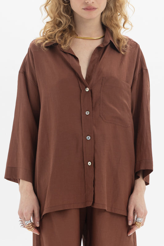 Relaxed Button-Up Shirt with dropped shoulders and a chest pocket for a laid-back feel.