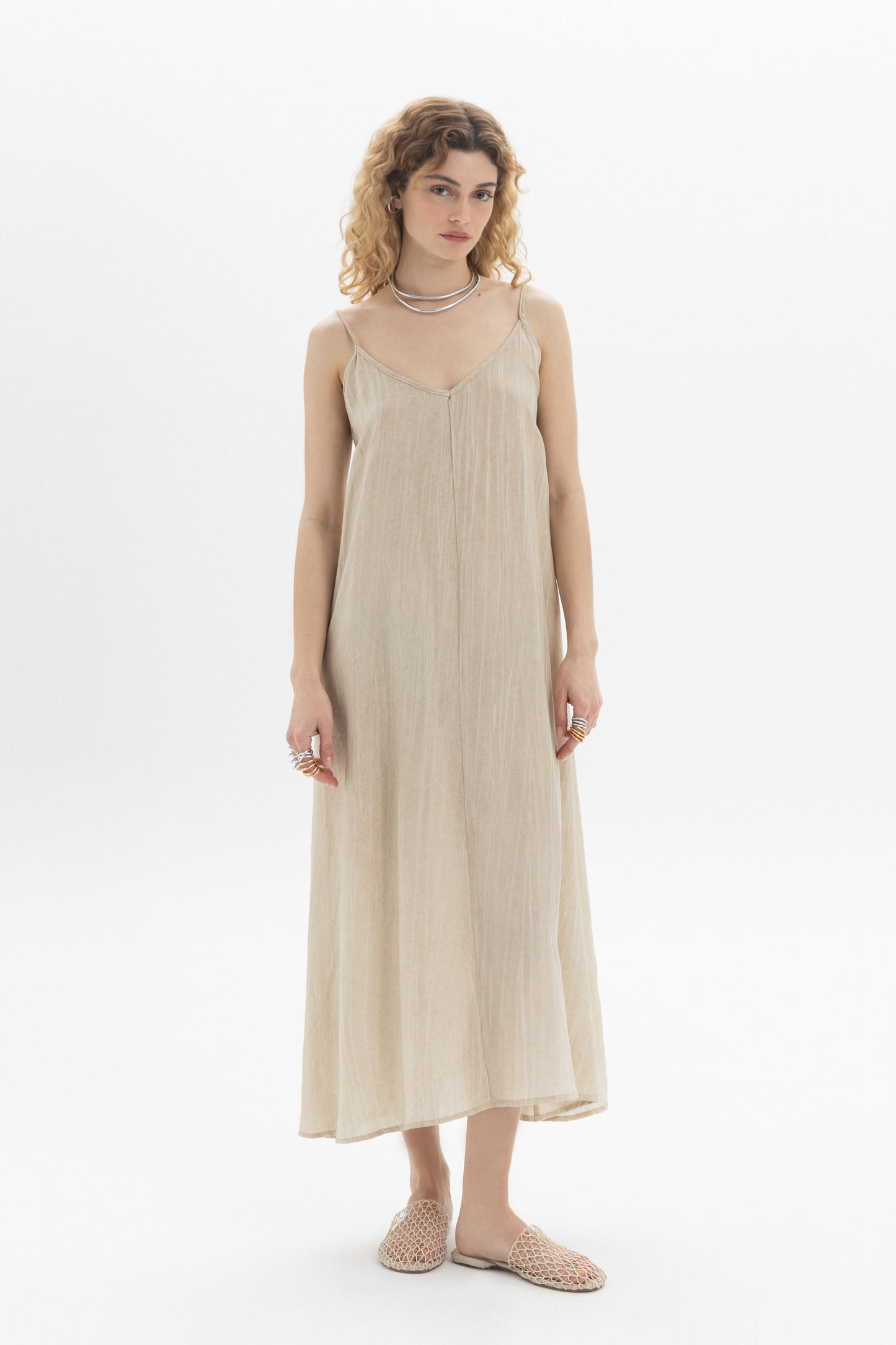 Long Slip Dress featuring thin straps and a soft V-neckline, designed for a relaxed fit.
