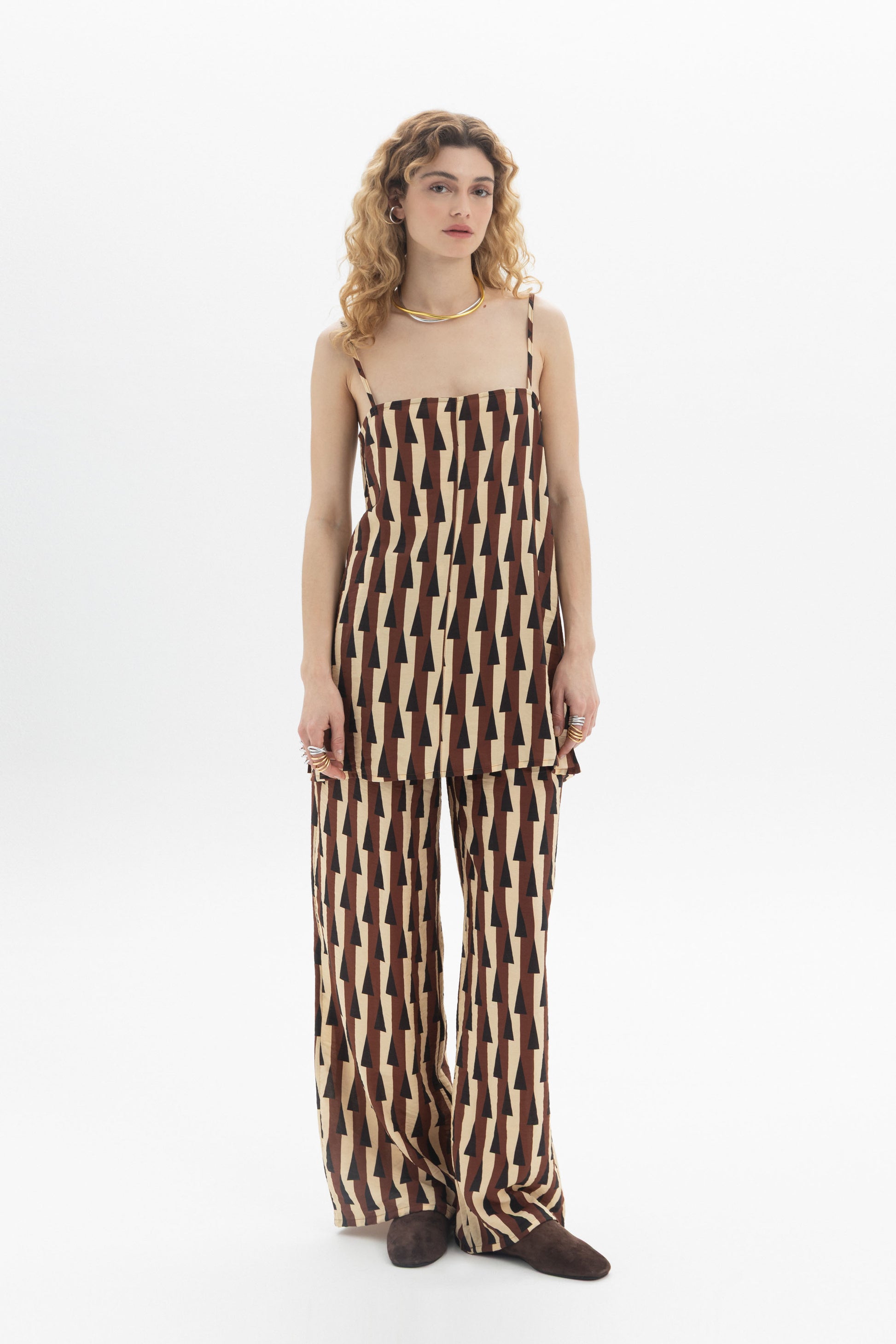 Longline Cami featuring a relaxed fit, thin straps, geometric print, and stylish matching pants.