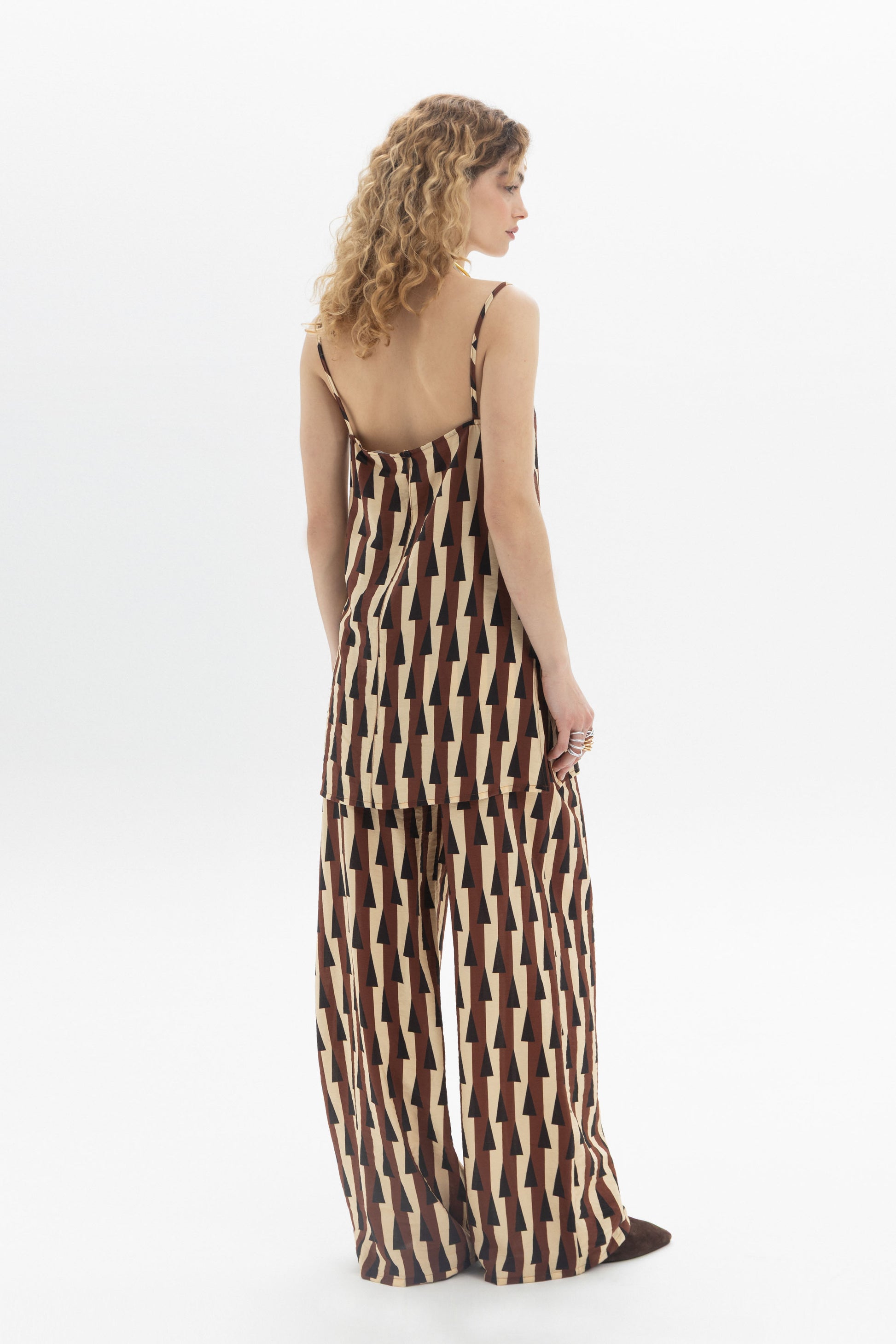 Longline Cami featuring thin straps, geometric print, and relaxed fit, showcased on a model from the back.