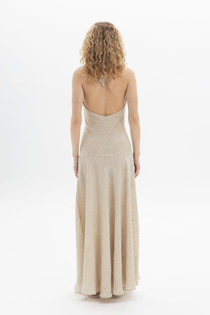Halter Maxi Dress viewed from the back, showcasing the fluid skirt and open back design.