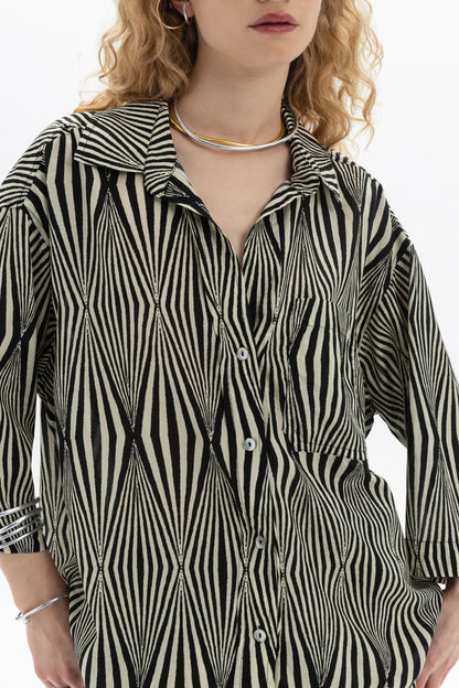 Relaxed Printed Shirt featuring a graphic print, classic collar, and chest pocket, perfect for casual wear.