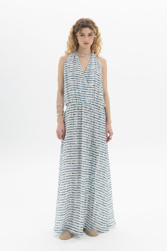 Open-Back Halter Dress featuring a halter neckline and deep open back in a flowing maxi style.