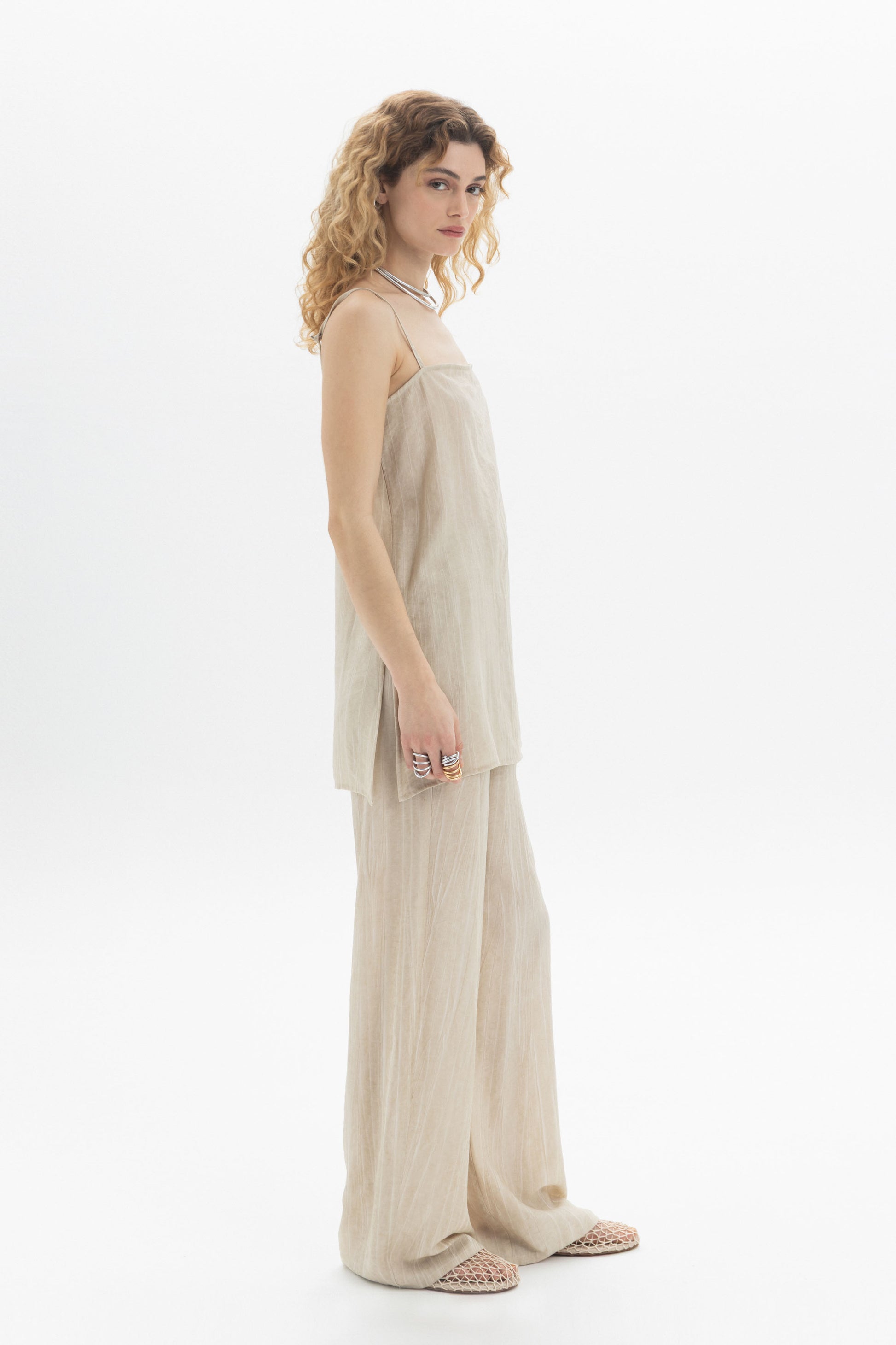 Fluid Cami longline camisole with slim straps and side slits for effortless movement in a relaxed silhouette.