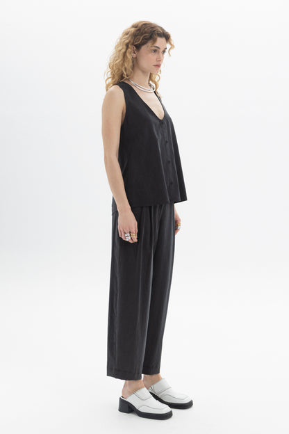 Black sleeveless button top in soft Tencel with deep V-neckline and relaxed silhouette.