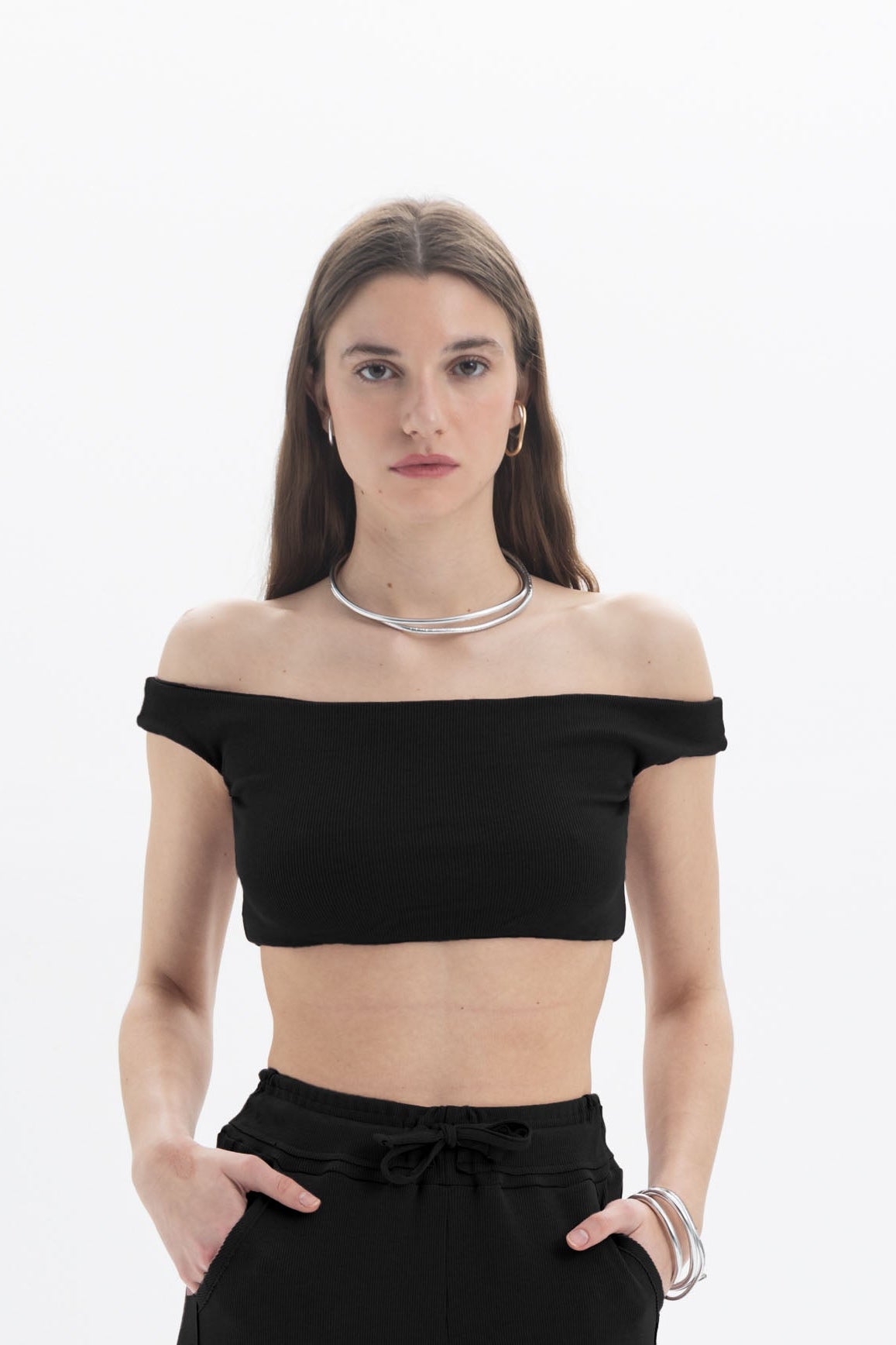 Black and Black B&B off-shoulder crop top featuring long sleeves and fitted design on a mannequin.