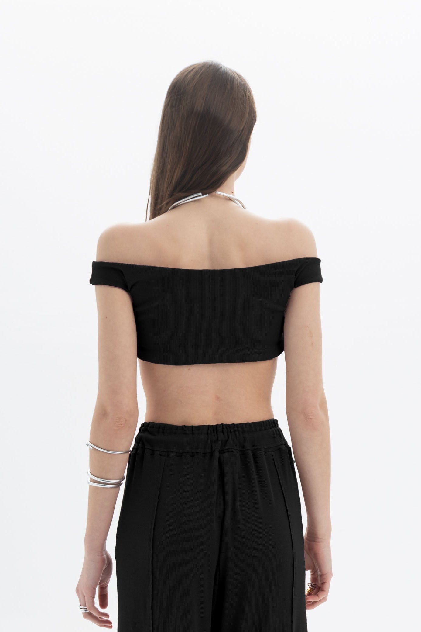 Black and Black B&B off-shoulder crop top with long sleeves, fitted design, and stylish neckline on a mannequin.