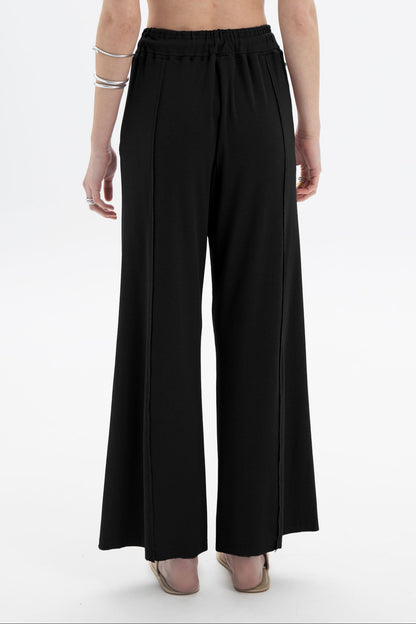 Black and Black B&B x F drawstring relaxed pants with a loose fit and casual style, shown on a neutral background.